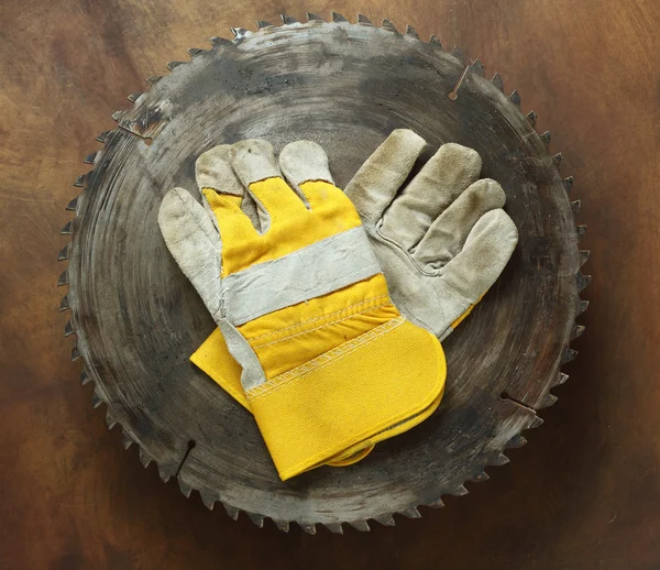 Circular saw and gloves — Stock Photo, Image