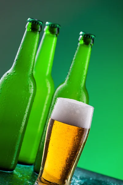 Beer bottles with full glass — Stock Photo, Image