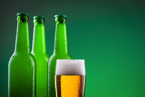 Beer bottles with full glass — Stock Photo, Image