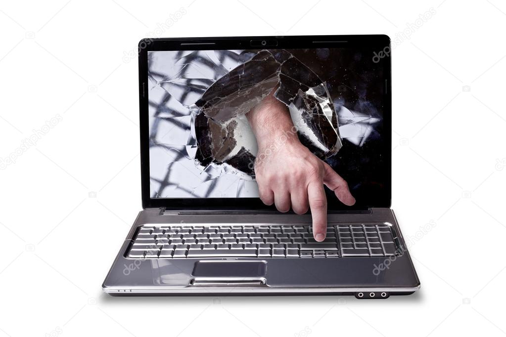 CONCEPT laptop with with broken screen the hand presses the button