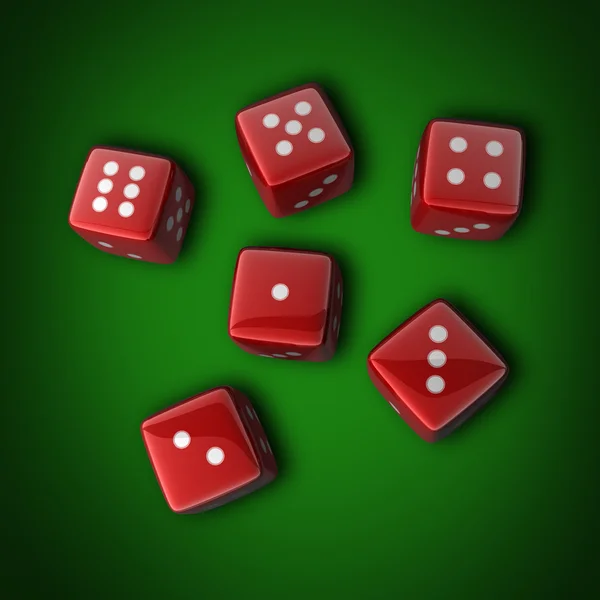 Червоні кубики на зеленому фоні — стокове фото