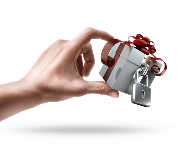 Man's hand holding gift box with the lock — Stock Photo, Image