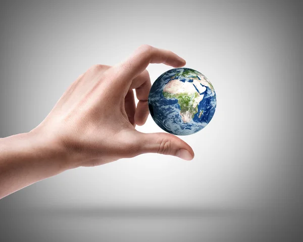 Man's hand holding globe. — Stock Photo, Image