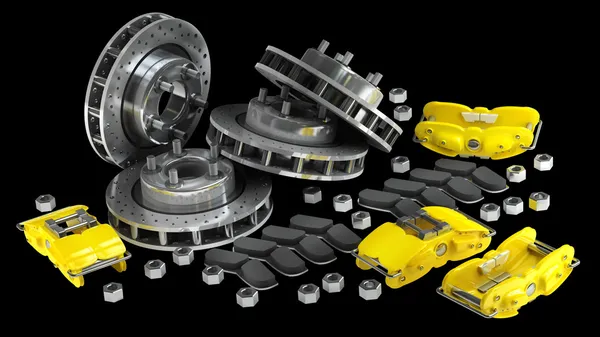 Disassembled brake discs with yellow calliper from racing cars — Stock Photo, Image