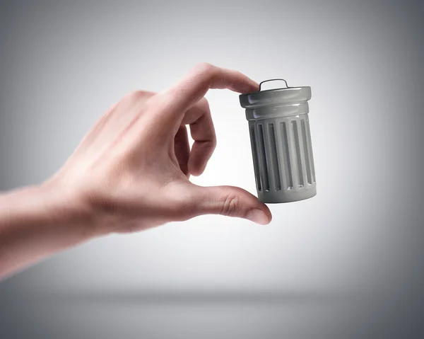 Man's hand holding Steel trash can — Stock Photo, Image