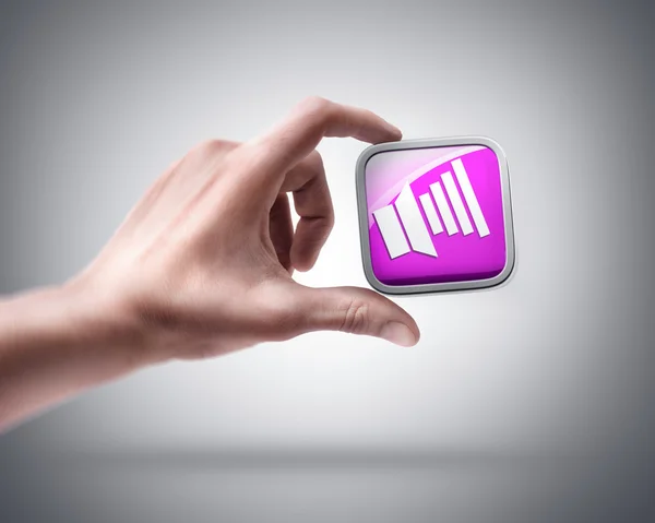 Ruka držící barva apps ikona — Stock fotografie