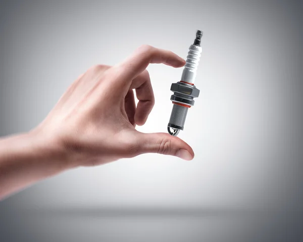 Hand holding Spark plug — Stock Photo, Image