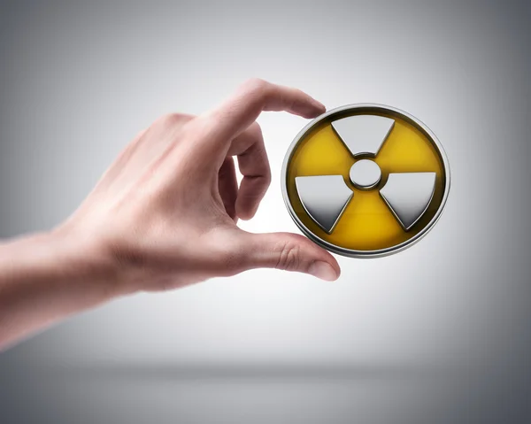 Hand holding Radiation Alert — Stock Photo, Image