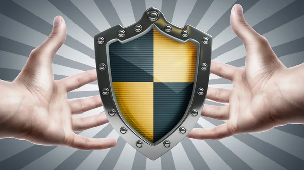 Shield depicting protection in hands — Stock Photo, Image