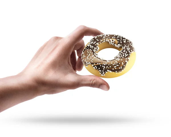 Hand holding doughnut — Stock Photo, Image