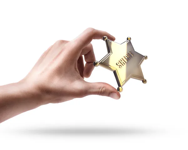 Hand holding Golden Sheriff Star — Stock Photo, Image