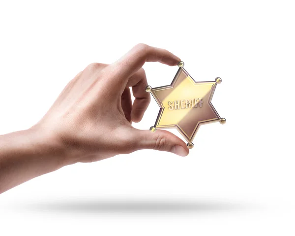 Hand holding Golden Sheriff Star — Stock Photo, Image