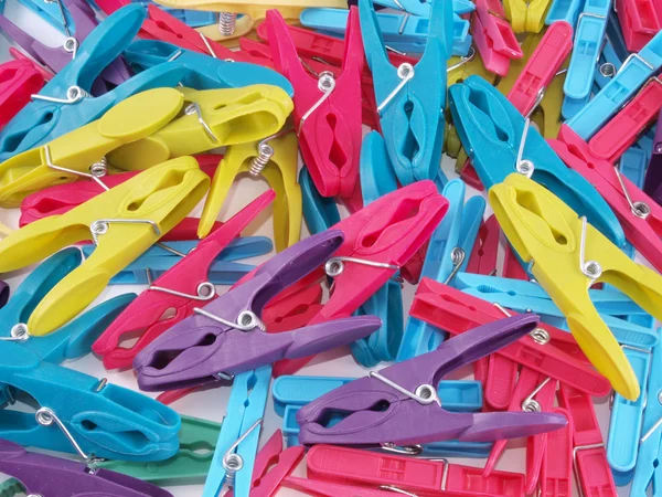 Multicoloured plastic clothes pegs. — Stock Photo, Image