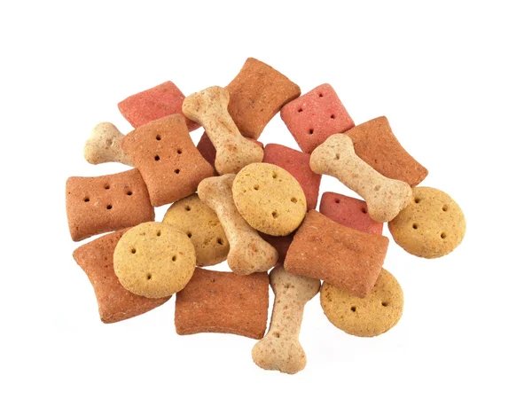 Assorted shaped dog biscuits on a white background. — Stock Photo, Image