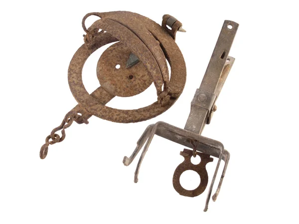 Close up photo of two old and rusty vermin traps on a white background — Stock Photo, Image