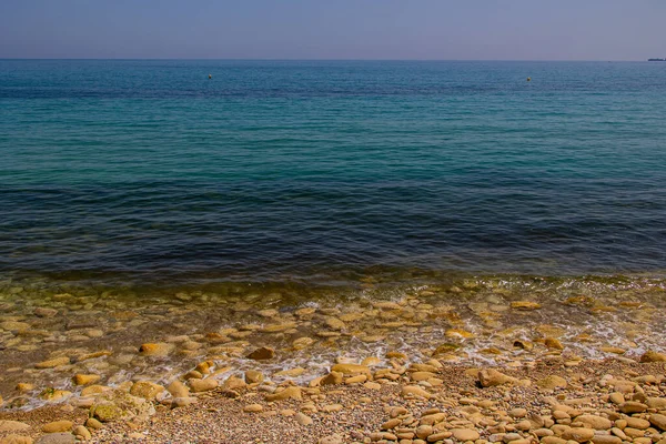 Beautiful Calm Gentle Background Blue Sea Shore Beige Stones — стоковое фото