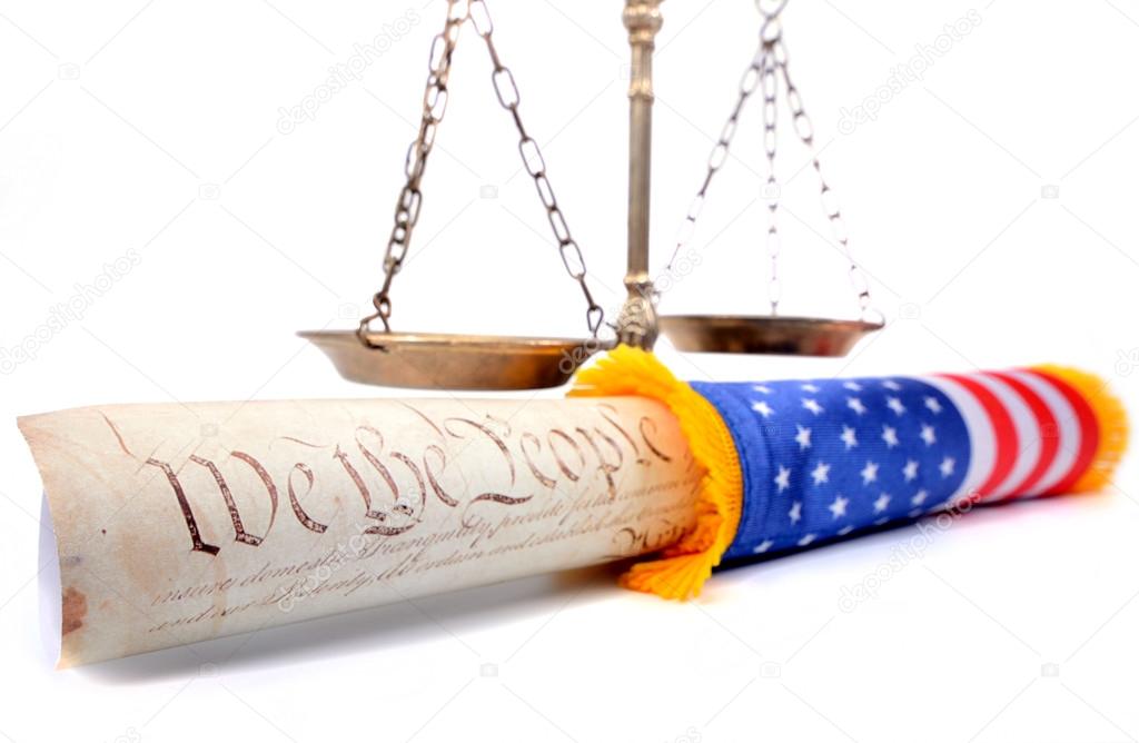 Scales of justice , American flag and US Constitution