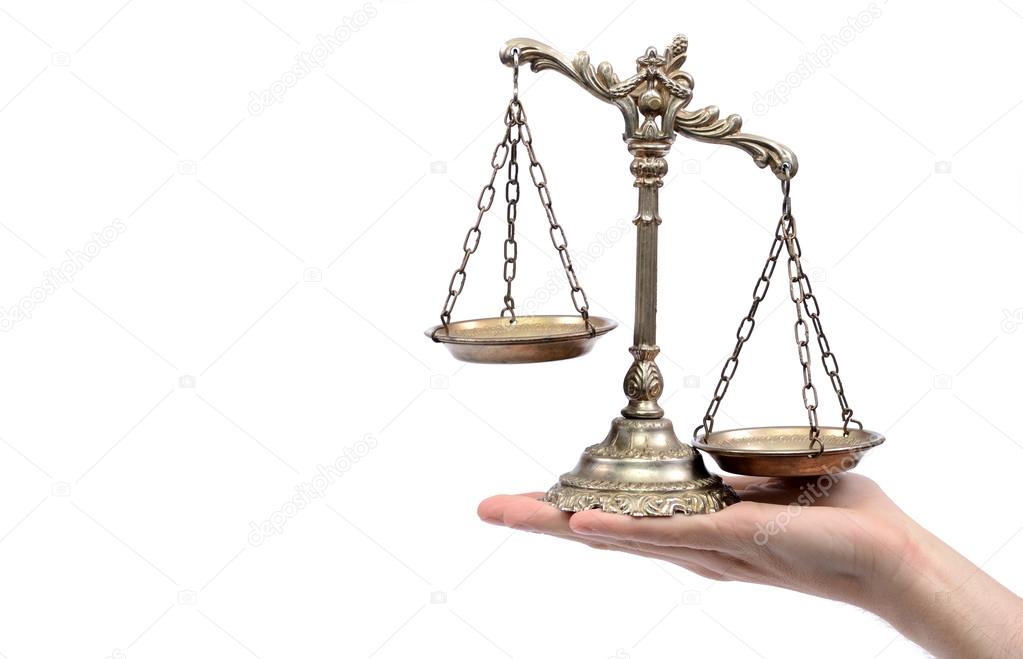 Holding Decorative Scales of Justice