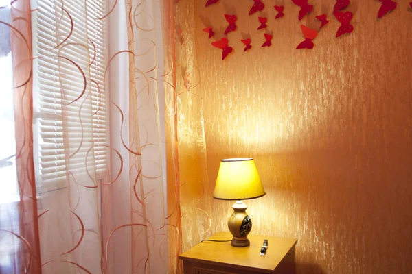 Bedroom interior with curtains, the lamp — Stock Photo, Image