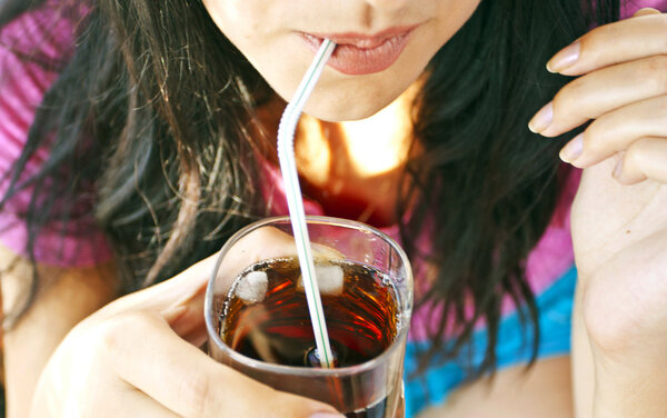 The woman drinking cocktail