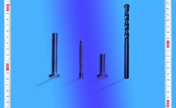 Diferentes parafusos de metal e fita de aço — Fotografia de Stock