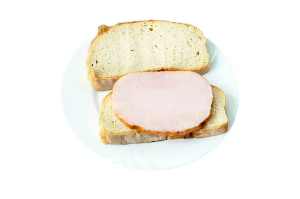 Brot mit saftig gekochtem Schweinefleisch auf einem Keramikteller — Stockfoto