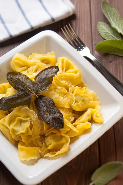 Ravioli stuffed to artichokes with butter and sage — Stock Photo, Image