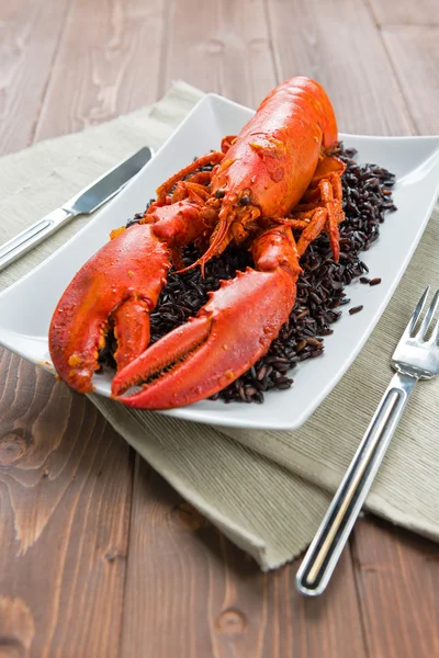 Langosta con arroz negro —  Fotos de Stock