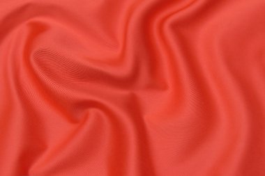 Doğal kırmızı ya da pembe kumaş ya da kumaşın yakın çekim dokusu aynı renkte. Doğal pamuk, ipek, yün veya keten kumaş dokusu. Kırmızı ve turuncu tuval arkaplan.