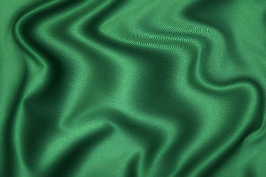 Doğal yeşil ya da kahverengi kumaş ya da kumaşın yakın çekim dokusu aynı renkte. Doğal pamuk, ipek, yün veya keten kumaş dokusu. Renkli tuval arkaplanı.