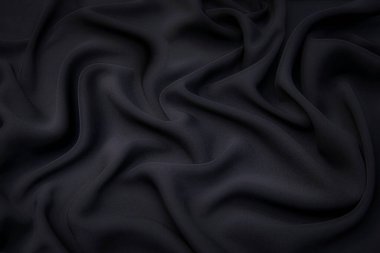 Kumaş dokusu, tasarım için arka plan. Siyah ipek, pamuk ya da yün kumaş. Dalgalı kumaşın güzel deseni.