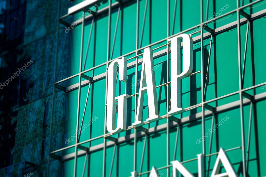 Moscow, Russia - February 02, 2021: Close up of the Gap logo above the store at the  shopping mall  in Moscow on a sunny day.