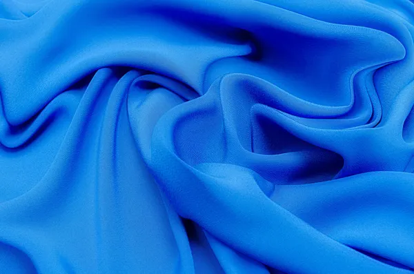 同一种颜色的天然蓝色面料或布的特写纹理 天然棉或蚕丝或羊毛织物的织物质感 蓝色帆布背景 — 图库照片