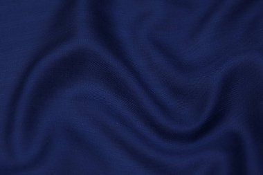 Doğal mavi kumaş ya da kumaşın yakın çekim dokusu aynı renkte. Doğal pamuk, ipek, yün veya keten kumaş dokusu. Mavi tuval arkaplanı.