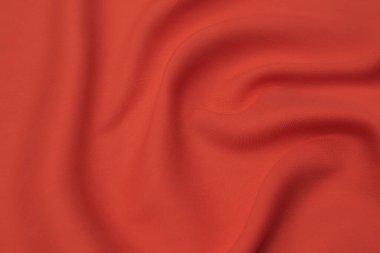 Doğal kırmızı ya da pembe kumaş ya da kumaşın yakın çekim dokusu aynı renkte. Doğal pamuk, ipek, yün veya keten kumaş dokusu. Kırmızı ve pembe tuval arkaplan.