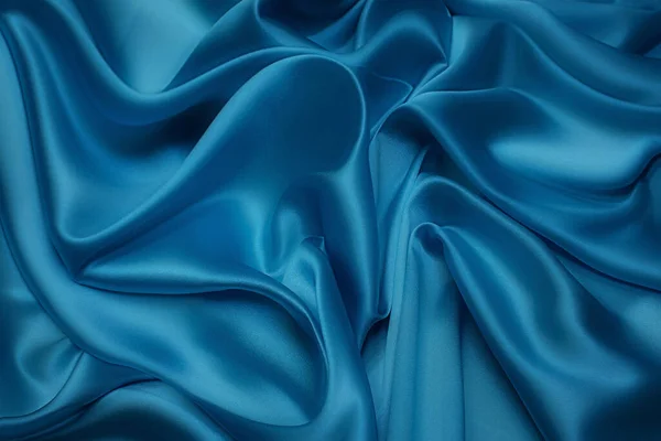 同じ色の天然ブルーの生地や布のクローズアップテクスチャ 天然コットン シルクまたはウールの生地の質感 またはリネンの繊維素材 青のキャンバスの背景 — ストック写真