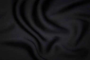 Doğal gri ya da siyah kumaş ya da kumaşın yakın çekim dokusu aynı renkte. Doğal pamuk, ipek, yün veya keten kumaş dokusu. Siyah tuval arkaplan.