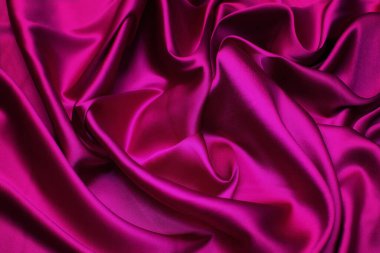 Doğal kırmızı, pembe, fuşya kumaşı ya da kumaşın yakın çekim dokusu aynı renkte. Doğal pamuk, ipek, yün veya keten kumaş dokusu. Kırmızı, pembe ya da fuşya kumaş kaplama arka plan.