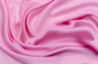 Doğal kırmızı ya da pembe kumaş ya da kumaşın yakın çekim dokusu aynı renkte. Doğal pamuk, ipek, yün veya keten kumaş dokusu. Kırmızı tuval arkaplanı.