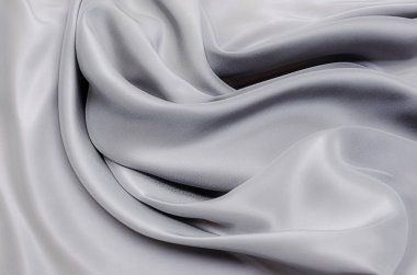 Doğal gri ya da siyah kumaş ya da kumaşın yakın çekim dokusu aynı renkte. Doğal pamuk, ipek, yün veya keten kumaş dokusu. Siyah tuval arkaplan.