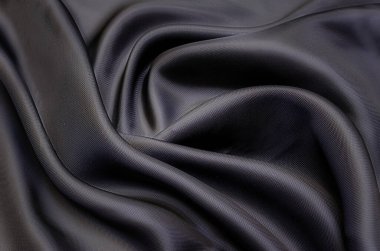 Doğal gri ya da siyah kumaş ya da kumaşın yakın çekim dokusu aynı renkte. Doğal pamuk, ipek, yün veya keten kumaş dokusu. Siyah tuval arkaplan.