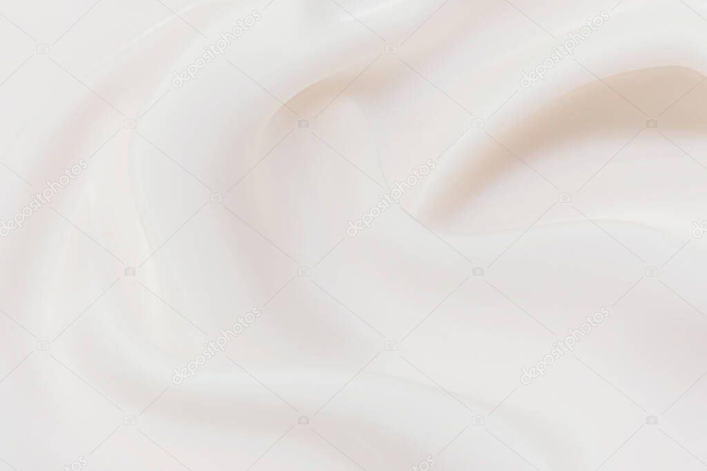Close-up texture of natural white or ivory fabric or cloth in same color. Fabric texture of natural cotton, silk or wool, or linen textile material. Ivory canvas background.