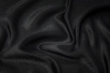 Pullu kumaş ve sanatsal düzende kayganlaştırıcı siyah. Doku, arkaplan, desen.