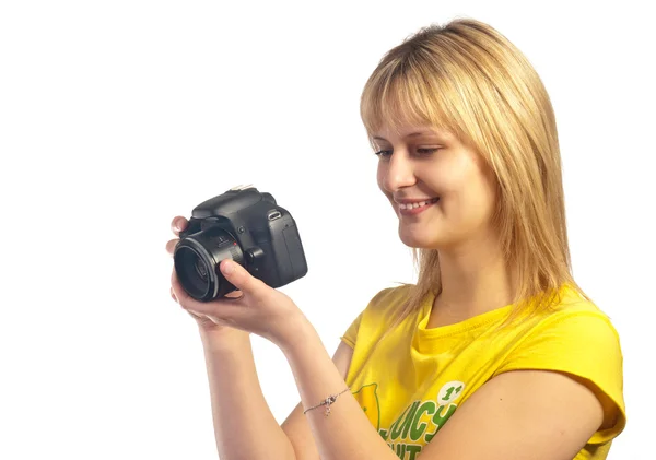Ung leende flicka med en dslr-kamera — Stockfoto