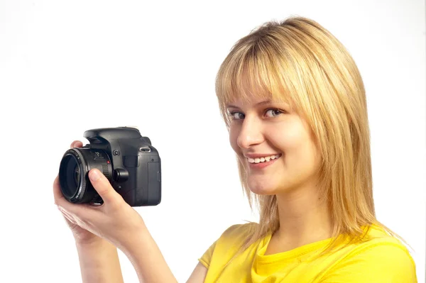 Ung leende flicka med en dslr-kamera — Stockfoto