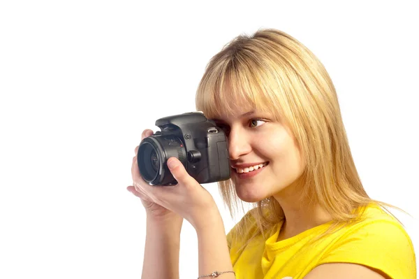 Bir dslr fotoğraf makinesi ile genç gülümseyen kız — Stok fotoğraf