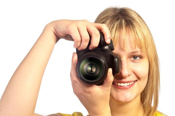 Young smiling girl with a dslr camera