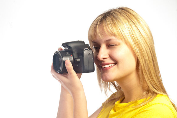 Young smiling girl with a dslr camera