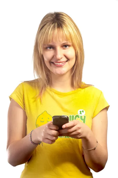 Young smiling girl with a mobile phone — Stock Photo, Image