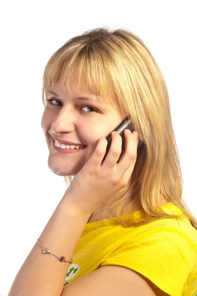 Menina sorrindo jovem com um telefone celular — Fotografia de Stock